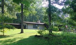 Amazing home, gentle land, private but not remote.. easy access.. ramped entry, 2 car attached carport.. Basement has inside and outside access, is heated, powered and would make a fantastic Den, or In-Law Qtrs. Located a few miles north of Franklin NC in