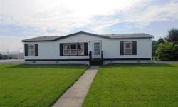 Exceptionally well maintained 94 dbl wide manufactured home in established Otis Orchards neighborhood with mature landscaping. 38X36 3 door insulated shop, fenced .27 acre lot on dead end street with full sprinkler system. Super private back yard