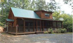 COZY 2/2 LOG CABIN ON 1.13 ACRES..This log cabin would be perfect for a vacation getaway or full time resident.Home has an open floor plan, hardwood floors throughout,spacious kitchen, stone fireplace,loft area with full bath, screened in front deck that