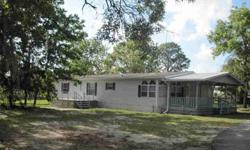 in Steeplechase Farms. Levy County's Premier Equestrian community. Built in 2000 this well maintained manufactured home has 3 bedrooms, 2 baths and over 1,600 square feet of living area. Front open deck and side covered patio overlooks your 5 fenced acres
