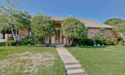 Near Lake Lewisville this 4 bedroom single story home features