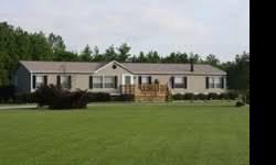 VERY SPACIOUS 4 Bedroom/2 Bath vinyl-sided home in country on 1.65 acres! Attention to detail throughout this home with hardwood floors, crown moldings, and excellent storage space. Living Room, Kitchen with Pantry, all appliances, Breakfast Bar,
