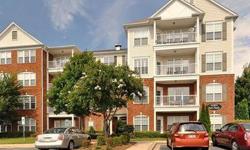 Ballantyne! This gorgeous 2-bedroom, 2-bath, third-floor condo located in an upscale gated community in South Charlotte features an open floor plan, gleaming hardwood floors, spacious kitchen with lots of cabinets, Corian countertops, tile backsplash and