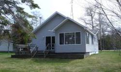Beautiful setting on McDonald Lake, 2 bedroom cottage, great 3/4 season room for rainy days, 90' of sand bottom frontage, good condition inside and out, 2 car detached garage. This cottage comes with most of the furnishings, appliances, dock, boat lift,