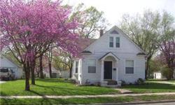 "Old Town" Lenexa beauty updated and ready to go. Newer furnace, windows, doors, flooring, lighting fixtures, stove and refrigerator, sump pump, etc. Move-in ready on a level double wide lot with 2 car detached garage. Exterior to be painted soon. No