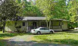 Remote living at the end of the road on 5 acres. Small contemporary home, 2 br, 2 ba. There is a small 'man cave basement' that was used as a TV room. Outdoor storage building. Home inspection is available, all items on the inspection were attended to.