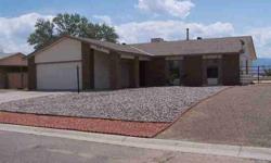 Move in Ready! 4 bedroom home with tile throughout the main living areas. Has both a dining area and breakfast nook. New carpet and paint, new kitchen appliances. Cozy wood burning stove and lovely views of the Sandia mountains from the back yard. The