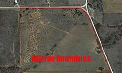 Corner property at cr 292 and 294 with partial open fields.