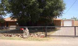 Rock & metal fence & large live oak trees, with rock surrounds, invite you into this 3 bedroom, 2 bath home. Open living, dining & kitchen area. Large den with storm cellar access. Back patio may be reached from living room, den or master bedroom. Approx.