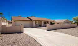 Move in ready home in the south side area of Lake Havasu! Nice tile flooring and shingle roof. Level driveway with full block wall in front and back. Inside open floor plan has vaulted ceilings and a rear kitchen with newer appliances. Split floor plan