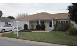 Great 2/2 Fir Model with Large Florida room Covered Screened Lanai Eat in Kitchen,Formal Dining Room,Living Room Insulated Garage with Pull down stairs,laundry Tub, in great shape Great Landscaping. This home would be great year round or Outstanding Snow