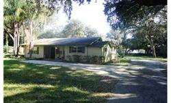 SHORT SALE Almost an acre of land located between USF & New Tampa. Great location only minutes from the interstate and USF. No deed restrictions!! Park your boat or RV. Plenty of space. Very large home with spacious rooms. Note the size of the great r