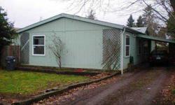 Beautiful Manufactured Home on Owned Lot! Open Kit w/ tons of storage,Desk & Pantry,Dining &Liv Room w/Laminate Flrs,Fenced Back Yard,Carport,Corner Lot,30 x 30 Lg Shop/Gar w/Concrete Flr,Industrial High Ceilings &Access from Back Yard. No HOA or CC&R's!