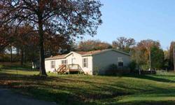 Wonderful, level, park-like 2.29 acres in Branson. 2BR/2BA 1663sqft Double Wide mobile on permanent foundation, with additional 500sqft 1BR/1BA Studio great for Guest Quarters, workshop, music studio or Home Based business. Main Home has new carpet,