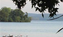 Kentucky Lake property. Lot #7 with 5.19 acres near Eagle-Bay Marina. Wooded, private tract with water front in Turkey Ck Bay. Boat slips available. Excellent owner financing terms available. For more info go to Eagle Bay Marina at Turkey Creek web