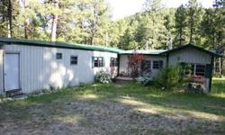 20575 Whitewood Creek Rd Rustic ?cabin-y? mobile home in secluded, beauty of Whitewood Creek Road. 2247 sq. feet. 5 bed/2 bath on 5.02 acres. No Covenants! 1974 mobile home with pole-built additions. Not on a permanent foundation. Comes fully furnished.