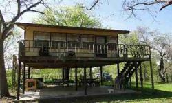 A weekend get-a-way on the Guadalupe River in Comfort across from Buckhorn Golf course. Approx 500ft of frontage on the river. Cabin is on 10ft. pier & beam stilts, large sitting porch, great room for plenty of extra sleepers, a kitchen w/apartment size