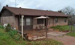 Remodeled brick home, detached garage/shop, 1983 mobile home(3 bedrooms/2 baths-currently used as storage), 10 acres, 2 wells, 2 septics, pond, paved roads!!!! All new roof, custom tile, carpet, light fixtures, fixtures, bathrooms, kitchen-- Must see to