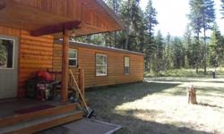 This property borders Forest Service land! Log sided manufactured home on a permanent foundation nestled in the trees on 1.78 acres. Open floor plan and a 12'x16' plumbed outbuilding on concrete floor. This property boasts of a quiet place to enjoy your