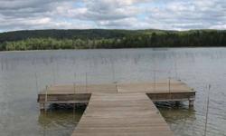 House-ready lot with 150' of frontage on Deer Lake has a paved turnaround drive, well and septic, buried propane tank, and views to beat the band. Take a stoll down the boardwalk to Deer Lake, where unspoiled frontage encircles this pastoral lake. Close