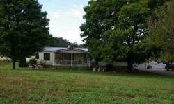 Located in Maryville, TN; this four acre property has a double wide with an attached garage; a 36X84 barn; a 16X20 workshop; and a storage shed and camper carport. Level pasture is mostly fenced and is located on a paved road. Drive to Maryville is easy