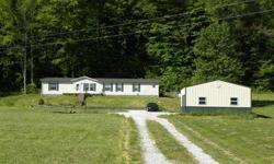 Comfortable Country Home. Space is the word for this one. LR/Dining Rm/Kit and Family Rm are great open flowing spaces. Kitchen has lots of cabinets, an island, pantry and room for a Breakfast table. Family Room with a woodburning fireplace, Living Room