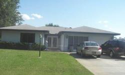 PRICE REDUCED!!!! OWNER WANTS TO HEAR OFFERS!!! You will be just a short boat ride away from Lake Grassy in this beautiful pool home! This 3/2/2 boasts split floor plan, spacious rooms, kitchen w/ island, indoor utility room, tile & laminate flooring in