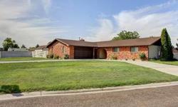 This home welcomes you to wide open living & family rooms accented w/a full brick wall fireplace. The 24' x 18' garage space has been nicely converted to living space w/pergo flooring & wood stove. This offers additional 432 SF & is not included in the