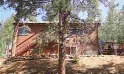 Talk about a lovely place to lay your head at night! This incredibly well-built home mountain home sits in the Turkey Rock community surrounded by National Forest. Only one lot seperates you from the Forest. Very open floor plan with lots of mountain