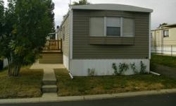 Location, location, location......... Completely remodeled inside/ outside Manufactured Home with 2 bedrooms, 1 bath and laminate floors all over. Dry-walls with crown moldings and base boards. Refrigerator less than a year old , washer and dryer