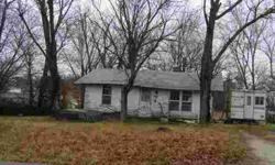 Older home has been gutted inside and could be repaired. Has nice lot and is close to Walmart and the banks. Would make a nice building spot for a home.Listing originally posted at http