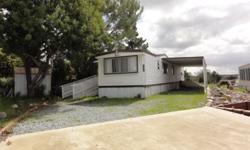 MOBILE HOME CONNECTION PRESENTS...
This home sits privately in a very large lot with beautiful views.
Great open split floor plan with bedrooms at each end.
Beautiful kitchen with stove and refrigerator included.
3rd. bedroom was converted into a spacious