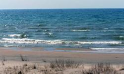100' of prime sugar sand beach front on the shores of beautiful Lake Michigan. When you see this property, you are going to want to own it! Michibay Subdivision is known for some of the finest Lake Michigan property in the Upper Peninsula and this wooded