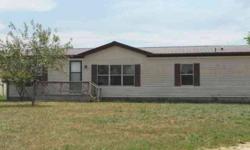 Modular home(26x60) with nice floor plan, already set-up with home and work-shop or small business. Family room with fireplace. Metal shop building(2688 sq ft) has heat and water, and 4 overhead doors. Was previously used as an auto rebuilding shop. Has a