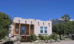Immaculate adobe home on cul-de-sac, high up on the mountain. 3 bedrooms, and 2 baths allow for plenty of space for family retreat, or year round living. Newer construction with large Master Suite, 5 piece bath with garden tub. Separate dining area, and