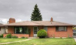 Beautiful Brick Rancher in the Shadle area. Covered front porch, two brick fireplaces, large kitchen with copper backsplash, double ovens, eating bar, slider to the covered patio, and detached 2-car brick garage. The basement has a large family room, 3/4