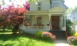 Lovely Victorian home in the heart of Fremont. Starting with a wrap-around front porch, and thru the original double doors with a transom above you will find many ameneties and lots of charm. There are four large rooms on the main floor, including a