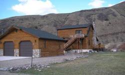Salmon River Frontage! Affordable country home with custom interior woodwork, vaulted ceilings, fireplace and deck that overlooks the beautiful Salmon River and mountains. A detached garage is also included. Super value! This is a Fannie Mae HomePath