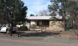 Charming and comfortable home in nice neighborhood on a wood lot. Open living area with wood burning fireplaces. Deck with views and great fenced backyard. Fruit trees.Listing originally posted at http