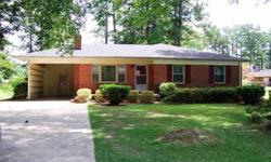Large brick ranch on spacious wooded lot! Inside you will find spacious rooms, including a great room that leads to the back patio and master bedroom connected to the office. In the office, you will find built-ins. The kitchen features a breakfast bar