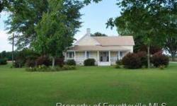 This charming farm house evokes the nostalgic feeling of yesteryear. Spacious light-filled rooms, High Ceilings, Front Foyer, Formal Dining and Living Rooms, Den, Country Kitchen, Sun Room, Utility Room, Three Bedrooms, Full Plus Half Bath. Covered front