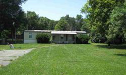 Rocky Fork Lake! Affordable weekend or retirement destination! 1987 mobile home! 2 bedroom, 1 bath open floor plan! Covered front porch and older storage building! Generous lawn and lush shade trees! Blacktop drive! Immediate possession! Bank