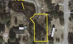 Partially wooded lot in Boiling Spring Lakes. Home next door for sale on two lots MLS# 667804. This lovely lot is nestled within the private community of Boiling Spring Lakes. Homesite backs up to a pond with beautiful nature views. Build your perfect