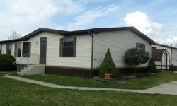 Beautiful Spacious Mobile home- 1400 sq feet- double wide 3 bedroom 2 full bath~Open concept with vaulted ceilings~Central air~30 yr Dimentional Roof ~seamless gutters in 2007~new toilets and faucets, neutral colors Faimly Room with natural