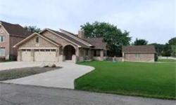 BEAUTIFUL ALL BRICK HOME BUILT BY OWNER/BUILDER. HARDWOOD FLOORS, VAULTED FAMILY ROOM, DBL SIDED FIREPLACE, HUGE EAT IN KITHCHEN W/ 42 INCH CABINETS, STONE COUNTER TOPS, PRIVATE GUEST SUITE, REC ROOM WITH WET BAR, DELUXE MASTER SUITE W/WIC, BALCONY.