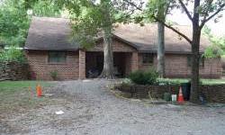 Built in 2000, this brick home is partially secluded due to it being constructed underground. Trees are plentiful on the property. Bedrooms are all spacious; property has been surveyed; central heat/air.Route #13 east to Pearce Road; turn right & go