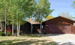 You will love the park-like setting, in this large, pie-shaped lot with lots of mature Aspen trees growing throughout! The one-leve 3 bedroom home has been tastefully updated and features wood-laminate flooring in the kitchen and dining room. Huge great