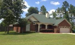 This all brick house in Crawfordville could be the next place you call home. Beautiful arch. details built in entertainment center/shelves; crown molding; stainless appliances in a large kitchen with corian counter tops and bars; nice dining area with