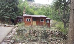 1 Bed, 1 bath cabin with detached storage garage on large .5+ acre lot in Bear Creek Canyon. Live close to trails and have the mountain feeling just minutes from town. Enjoy the cabin or build your house on one of the larger lots in the canyon.