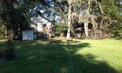 Savannah River house with dock and floating dock. Exceptional views of the river with mature oaks. Outdoor kitchen/pond house for entertaining guest. Cozy front porch across front of home. BBQ pit and stocked pond in back of home. Needs some TLC. Easy